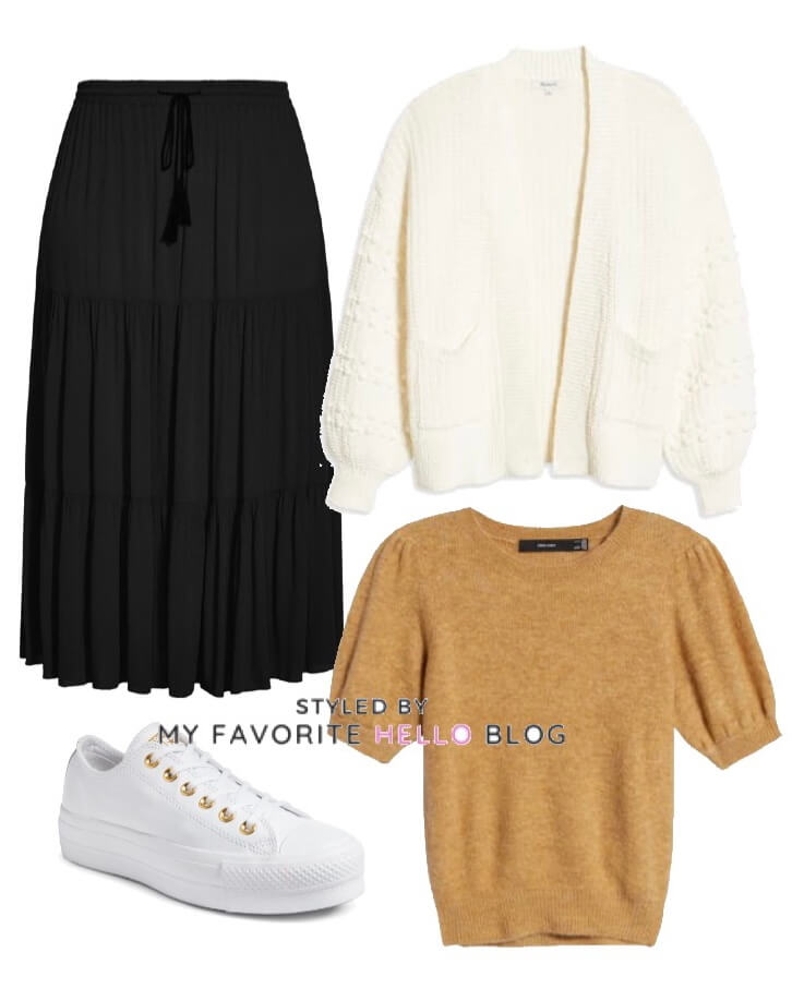 black skirt with white cardigan and white sneakers