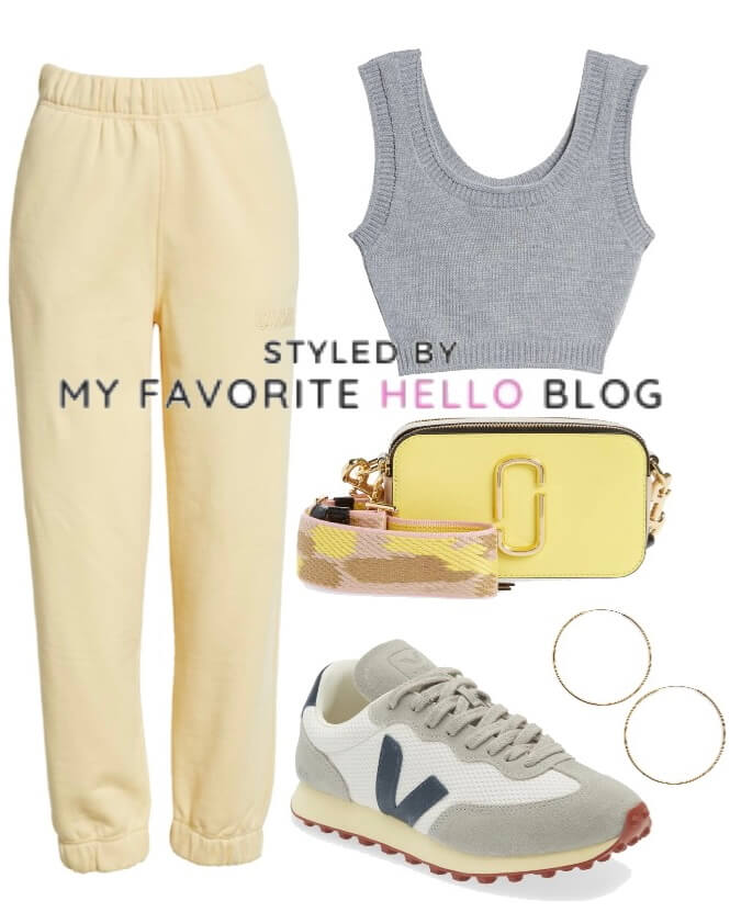 Yellow sweatpants with grey tank top and grey sneakers